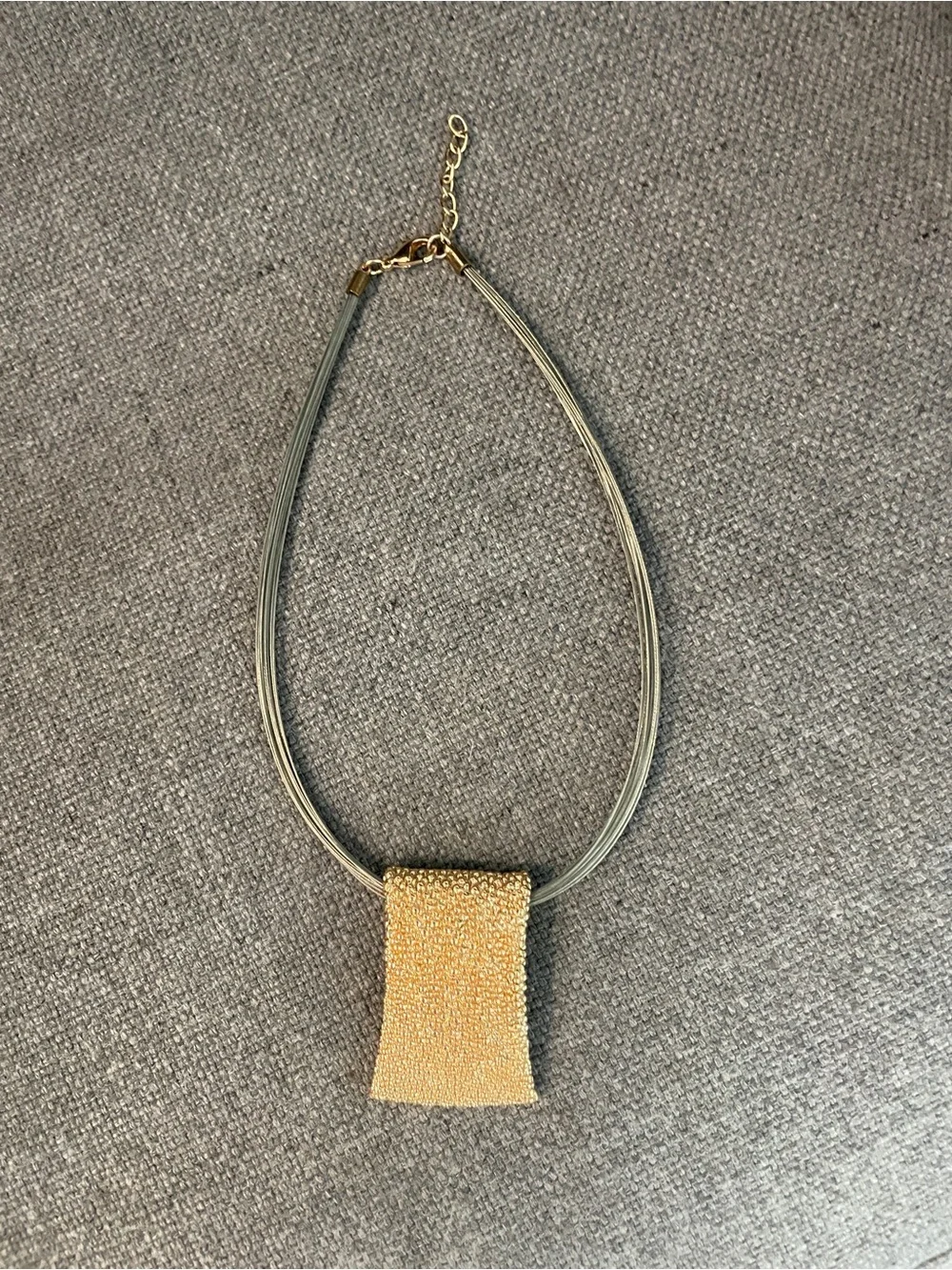Gold Pendant Necklace on Grey Cord